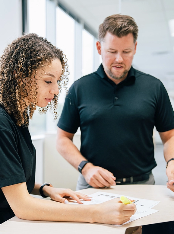woman and man looking at forms for renting a vehicle in Richmond